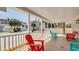 Relaxing front porch with colorful adirondack chairs at 510 Hillside Dr. S, North Myrtle Beach, SC 29582