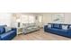 Living room with blue sofas and coastal decor at 510 Hillside Dr. S, North Myrtle Beach, SC 29582