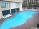 Outdoor pool with lounge chairs at 1207 S Ocean Blvd. # 21008, Myrtle Beach, SC 29577