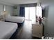 Bedroom with two double beds and balcony access at 1207 S Ocean Blvd. # 21008, Myrtle Beach, SC 29577