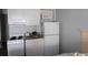 Well-equipped kitchenette with stove, fridge, and microwave at 1207 S Ocean Blvd. # 21008, Myrtle Beach, SC 29577