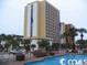 Exterior view of a high rise building with a pool at 1207 S Ocean Blvd. # 20606, Myrtle Beach, SC 29577