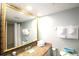 Bathroom with granite countertop, large mirror, and towels at 1207 S Ocean Blvd. # 20203, Myrtle Beach, SC 29577