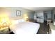 Comfortable bedroom with a king bed and access to kitchenette at 1207 S Ocean Blvd. # 20203, Myrtle Beach, SC 29577
