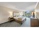 King-size bed, nightstands, and access to the balcony at 1105 S Ocean Blvd. # 246, Myrtle Beach, SC 29577