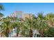 Resort-style pool with palm trees and nearby buildings at 1105 S Ocean Blvd. # 246, Myrtle Beach, SC 29577