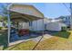 Metal carport, picnic table, and storage shed in backyard at 6001 - Mh197 South Kings Hwy., Myrtle Beach, SC 29575