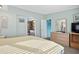 Main bedroom with ensuite access and large dresser at 6001 - Mh197 South Kings Hwy., Myrtle Beach, SC 29575
