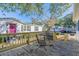 Wooden deck with metal table and chairs, overlooking the yard at 6001 - Mh197 South Kings Hwy., Myrtle Beach, SC 29575