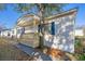 Single-wide mobile home with covered porch and mature tree at 6001 - Mh197 South Kings Hwy., Myrtle Beach, SC 29575