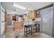 Kitchen with island, wooden cabinets, and tile floor at 6001 - Mh197 South Kings Hwy., Myrtle Beach, SC 29575