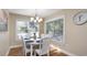 Bright dining area with white table and chairs, perfect for Gathering meals at 304 2Nd Ave. S, North Myrtle Beach, SC 29582