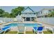 Private backyard oasis with a refreshing pool and lounge chairs at 304 2Nd Ave. S, North Myrtle Beach, SC 29582