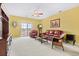 Bright living room with red leather couches and a balcony at 2050 Cross Gate Blvd. # 303, Myrtle Beach, SC 29575