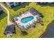 Community pool with plenty of lounge chairs and umbrellas at 2050 Cross Gate Blvd. # 303, Myrtle Beach, SC 29575