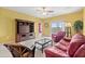 Living room with a leather sofa and a wooden media cabinet at 2050 Cross Gate Blvd. # 303, Myrtle Beach, SC 29575