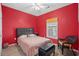 Bedroom with queen bed and wicker chair at 2050 Cross Gate Blvd. # 303, Myrtle Beach, SC 29575