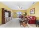 Comfortable living room with red leather furniture and access to a balcony at 2050 Cross Gate Blvd. # 303, Myrtle Beach, SC 29575