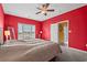 Red-walled bedroom with king-size bed at 2050 Cross Gate Blvd. # 303, Myrtle Beach, SC 29575