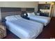 Two beds, nightstands, and kitchenette at 1501 S Ocean Blvd. # 815, Myrtle Beach, SC 29577
