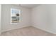 Simple bedroom with neutral walls, carpet, and a window at 153 Teddy Bear Circle, Conway, SC 29526