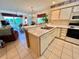 Kitchen features white cabinets, a double sink, dishwasher, and an electric stove at 606 Waterway Village Blvd. # 28-C, Myrtle Beach, SC 29579