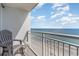 Oceanfront balcony with seating, offering stunning beach and seascape views at 2201 S Ocean Blvd. # 1705, Myrtle Beach, SC 29577
