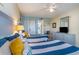 Guest bedroom with two twin beds, beach decor, and a view of the kitchenette at 2201 S Ocean Blvd. # 1705, Myrtle Beach, SC 29577