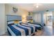 Guest bedroom with two twin beds, beach decor, and built-in dresser at 2201 S Ocean Blvd. # 1705, Myrtle Beach, SC 29577