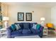 Living room with blue sofa and coastal decor at 2201 S Ocean Blvd. # 1705, Myrtle Beach, SC 29577