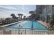 Sparkling outdoor pool with plenty of lounge chairs at 2201 S Ocean Blvd. # 1705, Myrtle Beach, SC 29577