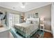 Main bedroom with king bed, water views, and coastal decor at 2502 Pointe Marsh Ln., North Myrtle Beach, SC 29582