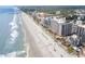 Aerial view of Ocean Reef Resort and the beach, with people enjoying the sand and surf at 7100 N Ocean Blvd. N # 1213, Myrtle Beach, SC 29572
