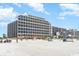 Oceanfront building and beach with people enjoying the sun at 7100 N Ocean Blvd. N # 1213, Myrtle Beach, SC 29572