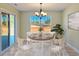 Charming dining room with wooden table and chairs, looking out to backyard at 370 Long Meadow Dr., Loris, SC 29569