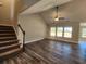 Living room with vaulted ceiling, hardwood floors and a view to the kitchen at 370 Long Meadow Dr., Loris, SC 29569