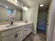 Double vanity bathroom with white cabinets and black matte fixtures at 370 Long Meadow Dr., Loris, SC 29569
