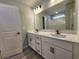 Double vanity bathroom with white cabinets and black matte fixtures at 370 Long Meadow Dr., Loris, SC 29569