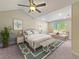 Spacious main bedroom with high ceiling, plush bedding, and seating area at 370 Long Meadow Dr., Loris, SC 29569