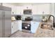 Modern kitchen with white cabinets, granite counters, stainless steel appliances at 370 Long Meadow Dr., Loris, SC 29569