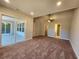 Bright bedroom with sliding glass door to patio, ceiling fan and en-suite bathroom at 370 Long Meadow Dr., Loris, SC 29569