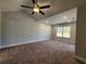 Spacious bedroom with carpeted floors, ceiling fan, and window at 370 Long Meadow Dr., Loris, SC 29569