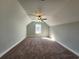 Well-lit bedroom with window, carpet, and ceiling fan at 370 Long Meadow Dr., Loris, SC 29569