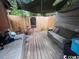Covered backyard deck with seating and a bicycle at 506 Maple St., Myrtle Beach, SC 29577