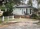 Single-story home with gray siding and white picket fence at 506 Maple St., Myrtle Beach, SC 29577