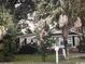 Tan single-story home with lush landscaping at 506 Maple St., Myrtle Beach, SC 29577