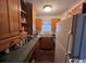 Small kitchen with wood cabinets and dark countertops at 506 Maple St., Myrtle Beach, SC 29577