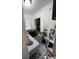 Small bedroom with a bed and gray and white tile floor at 506 Maple St., Myrtle Beach, SC 29577