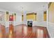 Elegant living room featuring hardwood floors, a fireplace, and classic design elements at 101 Greenwich Dr., Georgetown, SC 29440