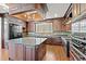 Modern kitchen with dark wood cabinets, granite countertops, and a large island at 101 Greenwich Dr., Georgetown, SC 29440